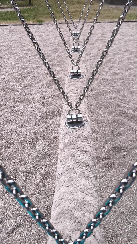 Swing, balance track with chains on the playground: perspective Stock Footage 313294964