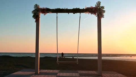 Swing on the beach at sunset Stock Footage 194413116