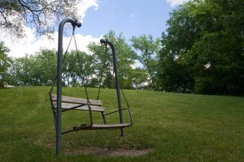 Swing bench in the park Stock Photos
