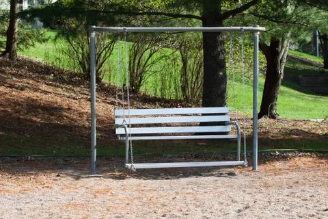 Swing bench in the park Stock Photos