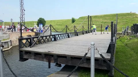 Swing bridge manually operated by two men Stock Footage 203972057