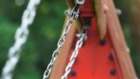 Swing Chains Swinging Back and Forth Close Up Slow Motion Video stock 117336050