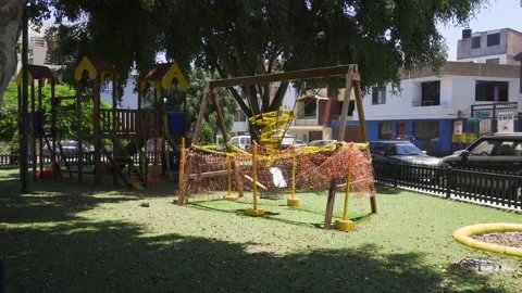 A swing in a children's playground closed exaggeratedly Stock Footage 150311430