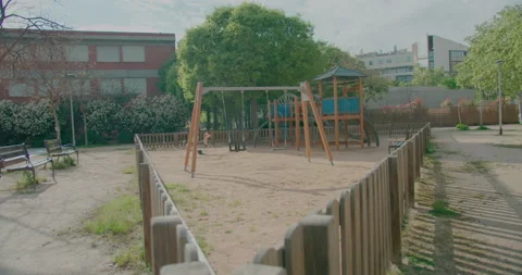 Swing closed with warning tape in children's playground in public park due to Stock-Footage 132070087