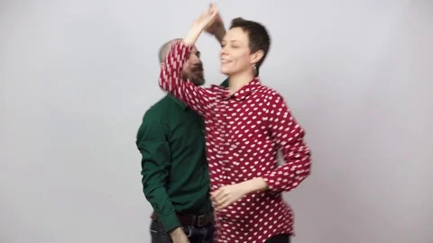 Swing dancers on white background. Man and woman are dancing lindy hop or boogie Video stock 124167877
