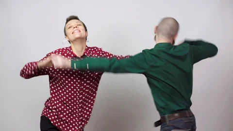 Swing dancers on white background. Man and woman are dancing lindy hop or boogie Video stock 124167994