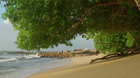 Swing on an empty beach on the ocean. Merisa Secret Beach. Tourist destinat.. Stock Footage 228293660