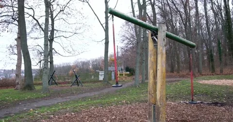 Swing in empty playground covered Stock Footage 145225101