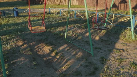 Swing empty swing in the playground 動画素材 136902175