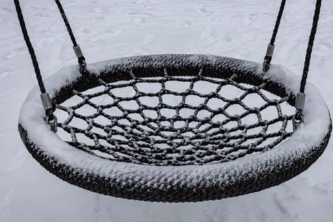 Swing in the form of a wicker circle or basket Stock Photos