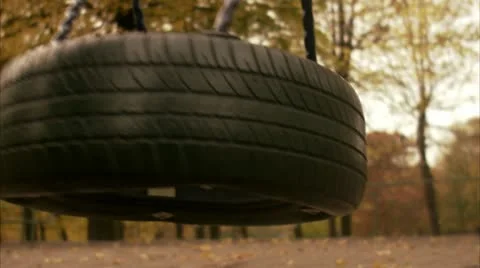 A swing in movement in a park Stock Footage 11284672