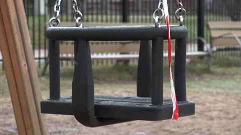 Swing moves. Close up. The playground is closed Stock Footage 151499871
