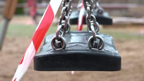 Swing moves. Close up. The playground is closed Stock Footage 151499886