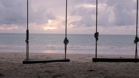 Swing near white sand beach with coconut tree in thailand with sunny summer.. Stock Footage 242342053