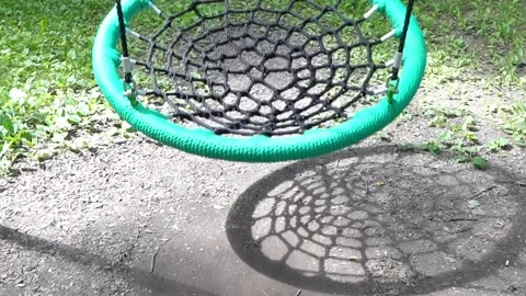 Swing nest in the park on a summer day, Swing repent. Empty nest swing at Stock Footage 280376205