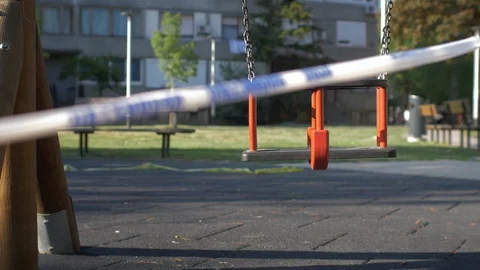 Swing in an open-air playground closed due to the Covid-19 Corona virus. Stock Footage 128933491