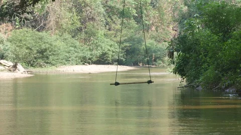 Swing over the stream Stock Footage 89041606