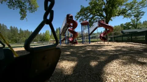 Swing with playground in back Stock Footage 9000658