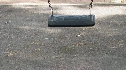 Swing at the playground in the park Stock-Footage 65290586