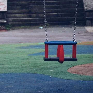 Swing in the playground Stock Photos