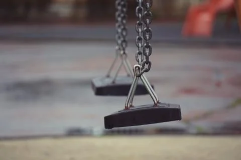 Swing in the playground Stock Photos