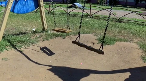 Swing on the playground without children Stock Footage 53842707