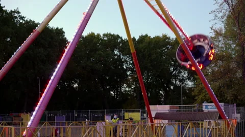 Swing ride with bright multicolored lighting during a pandemic Stock Footage 140041341