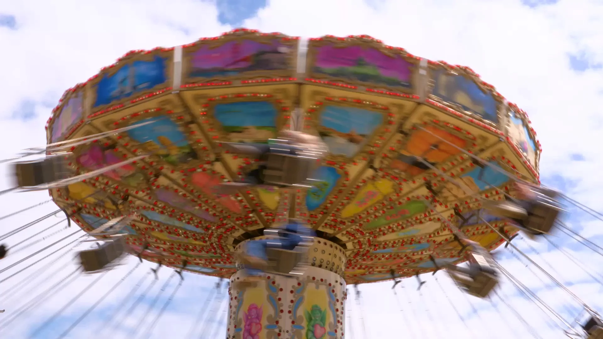 swing roller coaster going round on summer day