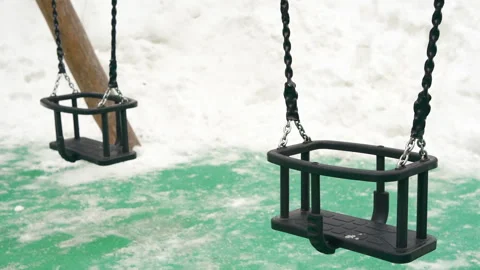 Swing on rope chain playground winter Video stock 266780989