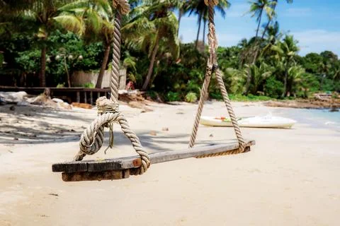 Swing on sand beach. Stock Photos