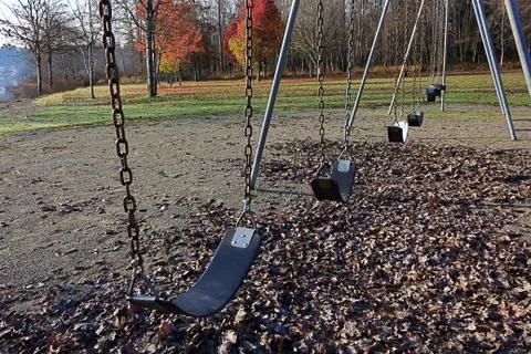 Swing set in late fall Stock Photos