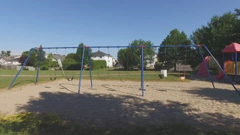 Swing set in a park gimbal smooth movement Stock Footage 103644594