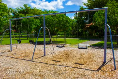 Swing Set in Park Playground Stock Photos