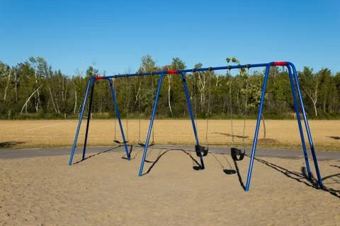 Swing set at the playground Stock Photos