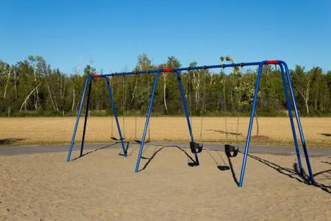 Swing set at the playground Stock Photos