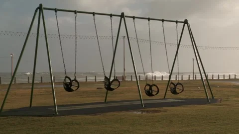 A swing set on Sea Point beach front Stock Footage 310385769