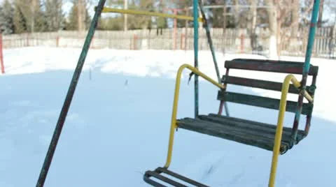 Swing in snowy garden Stock Footage 10834852