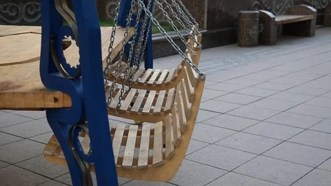 Swing suspended on chains, driven by the wind Stock Footage 113819817