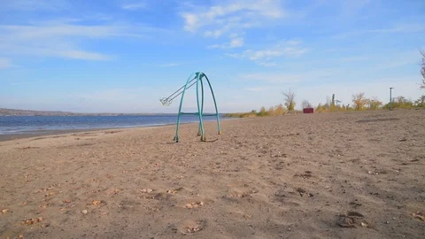 Swing swing on an empty sandy beach on a sunny day Stock Footage 118505712