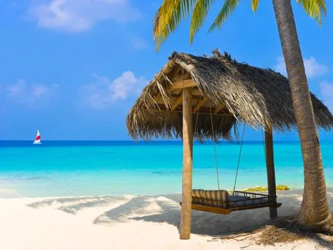 Swing on a tropical beach Stock Photos