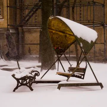 Swing under the snow Stock Photos