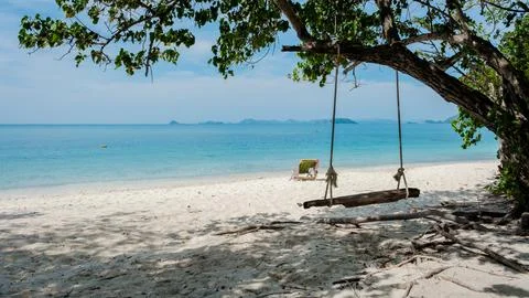 A swing under a tree at the beach of Ko Kham Island Sattahip Chonburi Samaesan Stock Photos