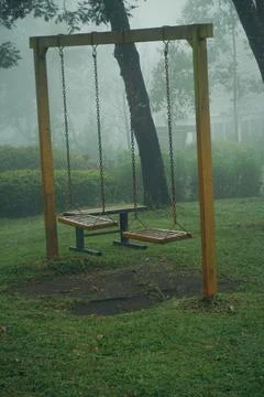 Swing under trees Stock Photos