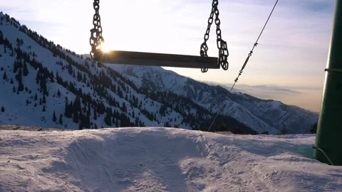 Swing in winter mountains with sunset view Video stock 229931068