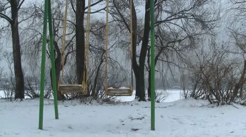 Swing in winter park Stock Footage 10797694