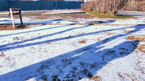 Swing in the winter shadow of a child Video stock 220200182