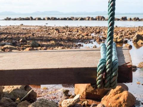 Swingfocus on rope on the beach. Stock Photos