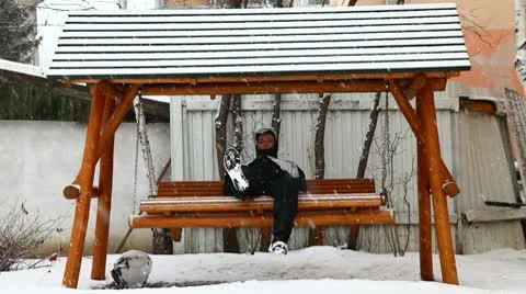 Swinging alone in wintertime Stock Footage 10761068