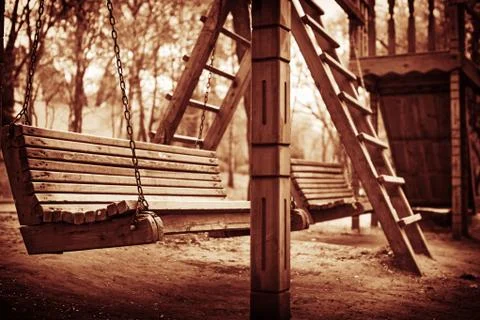A swinging bench deep in the woods Stock-Fotos