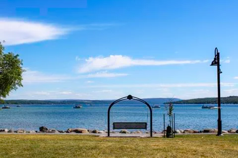 Swinging bench on the lakeshore Stock Photos